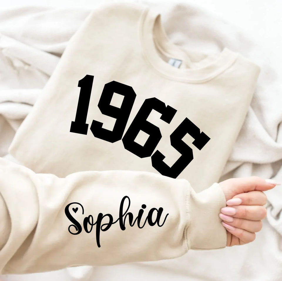 Custom Year 1965 - 60th Birthday Women Sweatshirt with Name on Sleeve