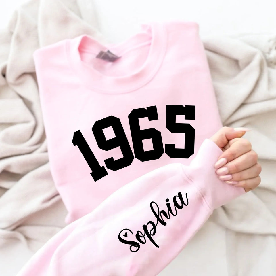 Custom Year 1965 - 60th Birthday Women Sweatshirt with Name on Sleeve